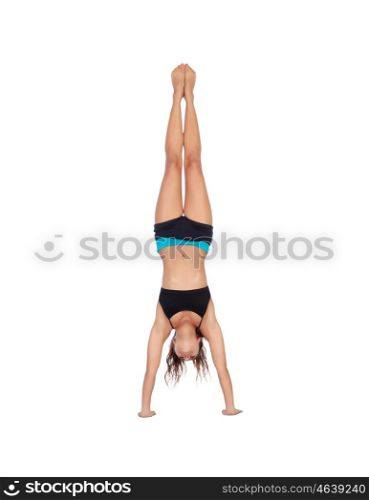 Beautiful woman do handstands isolated on a white background