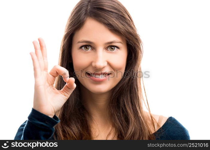 Beautiful woman doing a OK signal with her hand. Positive woman
