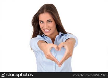 Beautiful woman doing heartshape with hands