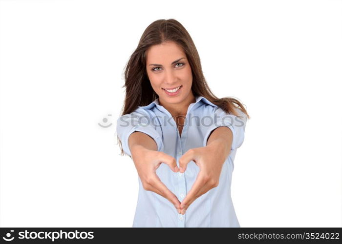 Beautiful woman doing heartshape with hands