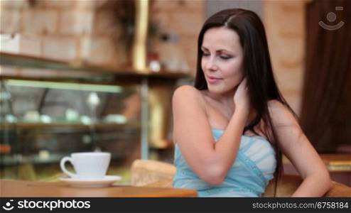 beautiful woman drinking coffee in a coffee shop