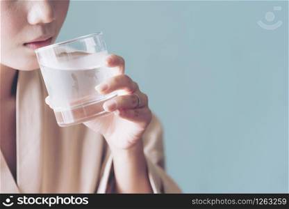 Beautiful woman drinking fresh cold water. Refreshment Skincare