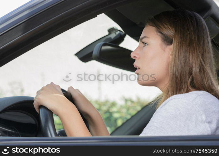 beautiful woman driving a car