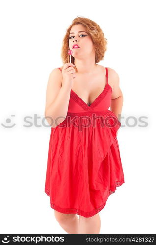 Beautiful woman eating a lollipop, over white background