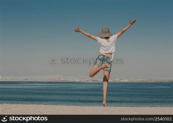 Beautiful woman enjoying a day at the beach