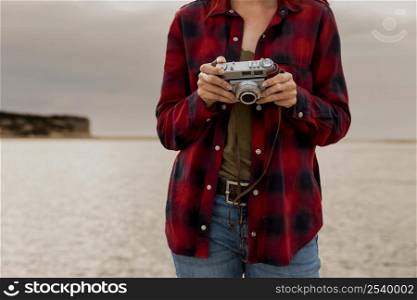 Beautiful woman enjoying her day taking pictures with her camera