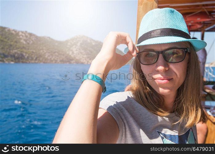 Beautiful woman enjoying her vacation on a cruise of Mediterranean Sea. Vacation on a cruise of Mediterranean Sea