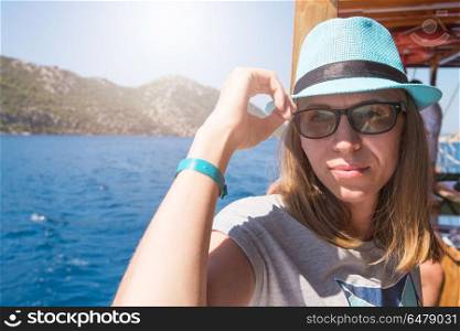 Beautiful woman enjoying her vacation on a cruise of Mediterranean Sea. Vacation on a cruise of Mediterranean Sea
