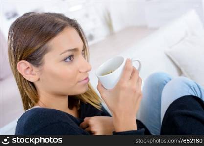 beautiful woman enjoying the smell of coffee in the morning