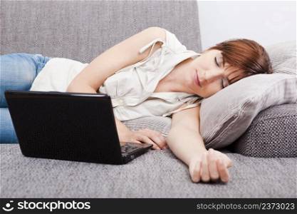 Beautiful woman exhausted after working with a laptop
