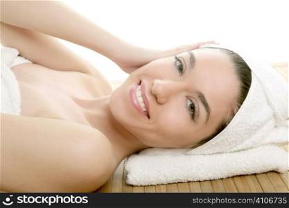 Beautiful woman face massage with towel around her head