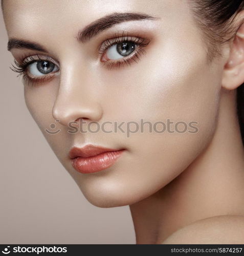 Beautiful woman face. Perfect makeup. Beauty fashion. Eyelashes. Cosmetic Eyeshadow. Highlighting