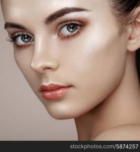 Beautiful woman face. Perfect makeup. Beauty fashion. Eyelashes. Cosmetic Eyeshadow. Highlighting