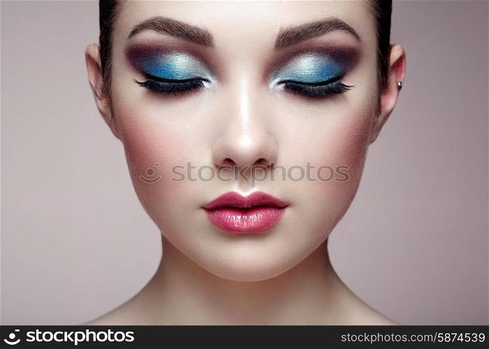 Beautiful woman face. Perfect makeup. Beauty fashion. Eyelashes. Lips. Cosmetic Eyeshadow