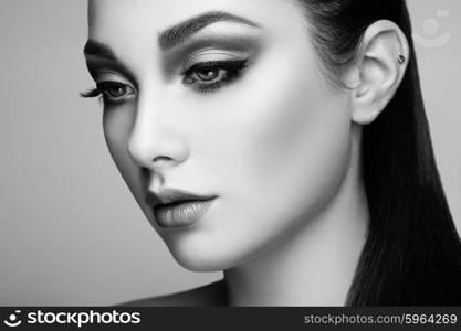 Beautiful woman face. Perfect makeup. Beauty fashion. Eyelashes. Lips. Cosmetic Eyeshadow