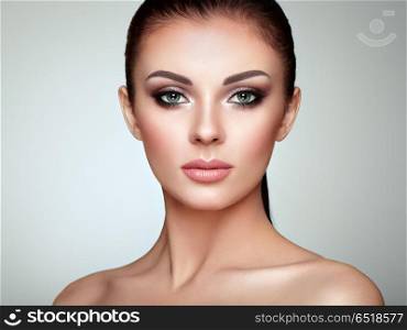 Beautiful woman face with perfect makeup. Beautiful Young Woman with Clean Fresh Skin. Perfect Makeup. Beauty Fashion. Eyelashes. Cosmetic Eyeshadow. Highlighting. Cosmetology, Beauty and Spa