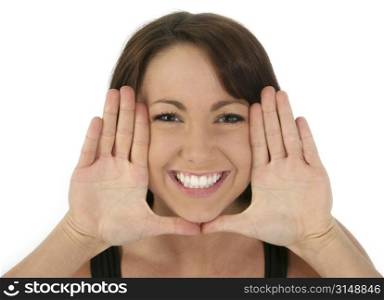 Beautiful woman framing face with hands. Palms out.