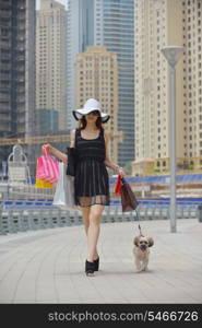 beautiful woman goes in shopping in the city