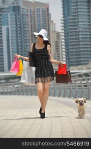 beautiful woman goes in shopping in the city