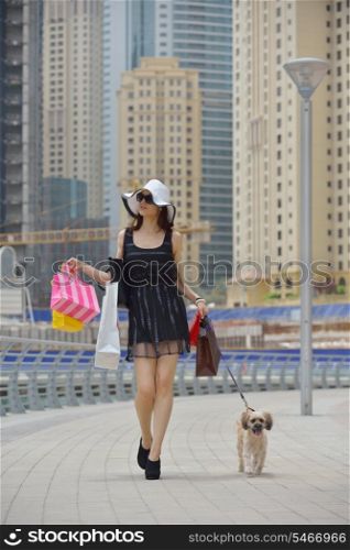 beautiful woman goes in shopping in the city