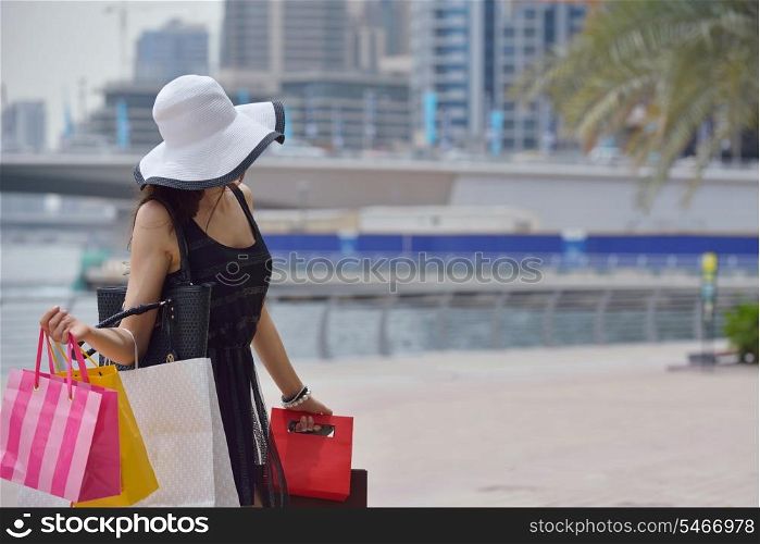beautiful woman goes in shopping in the city