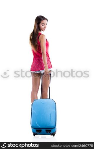Beautiful woman going on vacation and walking with a suitcase