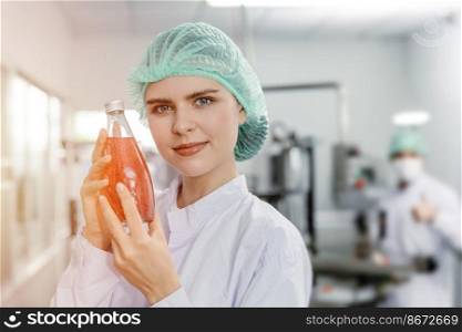 beautiful woman hand holding juice drink in glass bottle for advance science beverage product for beauty and healthy women concept