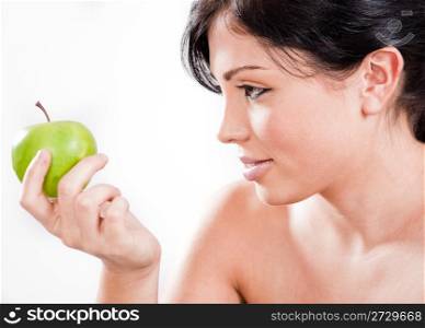 Beautiful woman holding a apple,indoor studio