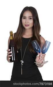 Beautiful woman holding a bottle of wine and glasses