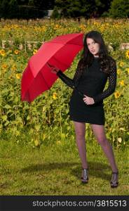 Beautiful woman holding a colorful and fashionable umbrella