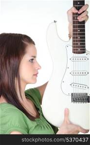 beautiful woman holding a guitar