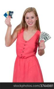 Beautiful woman holding a hand full of 100 dollar bills and credit cards