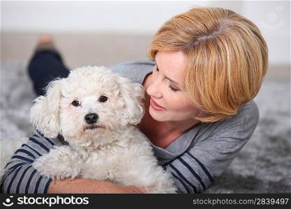 beautiful woman holding a little dog