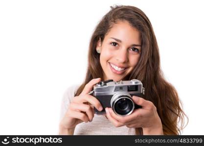 Beautiful woman holding a vintage camera, isolated over white background