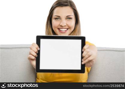 Beautiful woman holding and showing something on a tablet