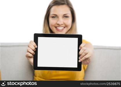 Beautiful woman holding and showing something on a tablet