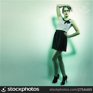 beautiful woman holding arm over her head. beautiful woman holding arm over her head in green light