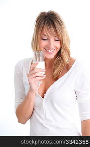 Beautiful woman holding glass of milk