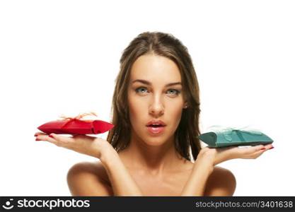 beautiful woman holding green and red presents. beautiful woman holding green and red presents on white background
