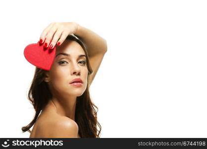 beautiful woman holding heart over her head. beautiful woman holding red heart over her head on white background