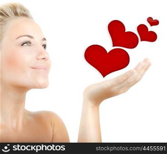 Beautiful woman holding hearts in hand, sensual female portrait isolated on white background, cute girl expressing tender feelings, conceptual image of health care and love