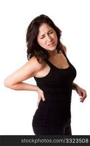 Beautiful woman holding her back with pain and ache due to injury,wearing a sporty black tank top, isolated.