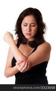 Beautiful woman holding her elbow with pain and arm ache,wearing a sporty black tank top, isolated.