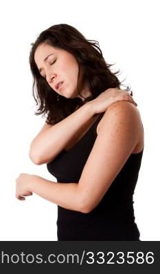Beautiful woman holding her shoulder with neck pain and ache due to stress,wearing a sporty black tank top, isolated.