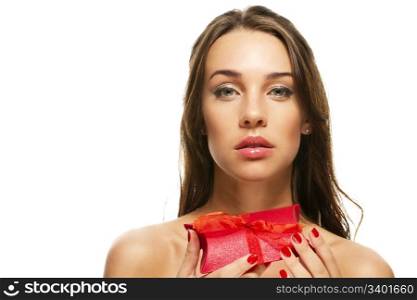 beautiful woman holding red present. beautiful woman holding red present on white background