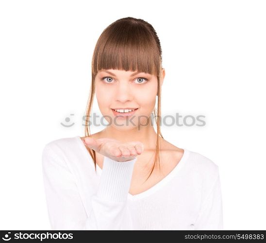 beautiful woman holding something on the palm of her hand