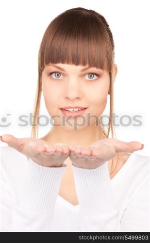 beautiful woman holding something on the palms of her hands