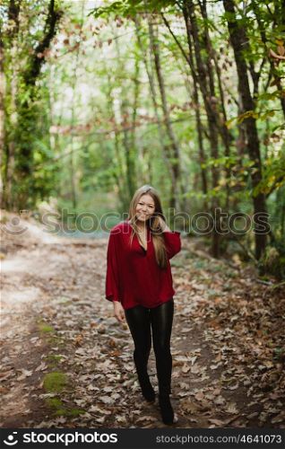 Beautiful woman in a beautiful forest in autumn