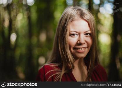 Beautiful woman in a beautiful forest in autumn