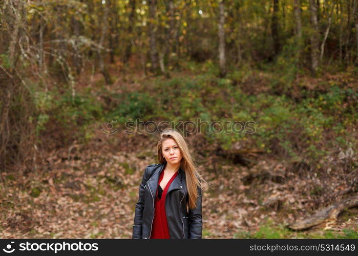 Beautiful woman in a beautiful forest in autumn